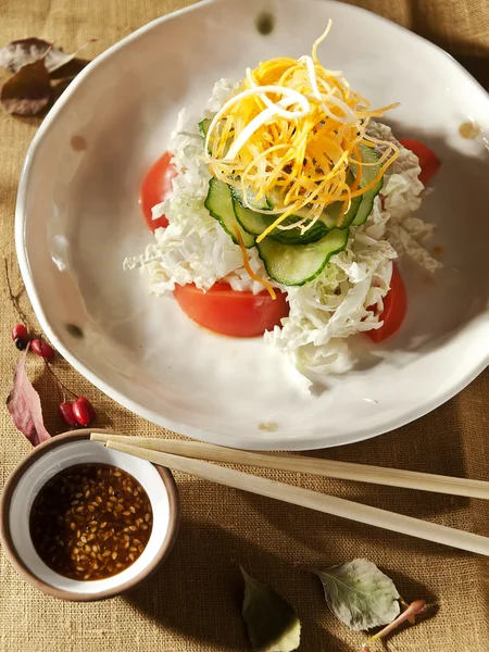 Fresh salad with cucumber,carrots and cabbage — Stock Photo, Image