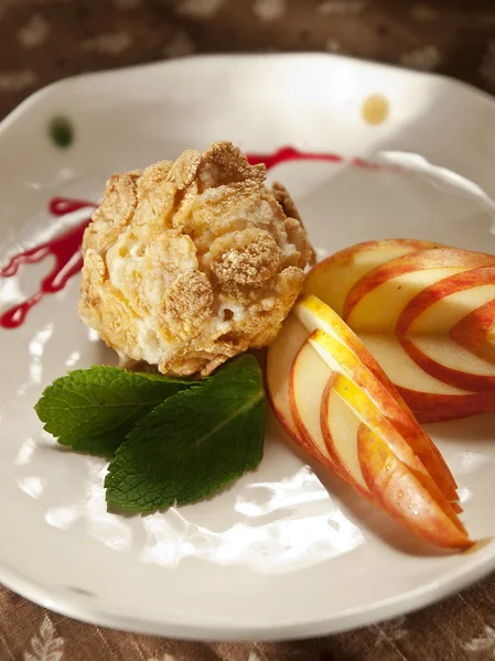 Delicious restaurant dessert, fried ice cream served with whipped cream and fruit coulis — Stock Photo, Image