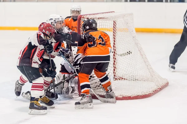 Game between children ice-hockey teams