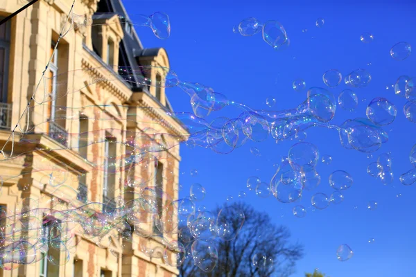 Oap bubbles floating in a blue sky — Stock Photo, Image
