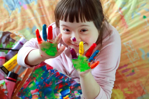 Cute little girl with painted hands — Stock Photo, Image