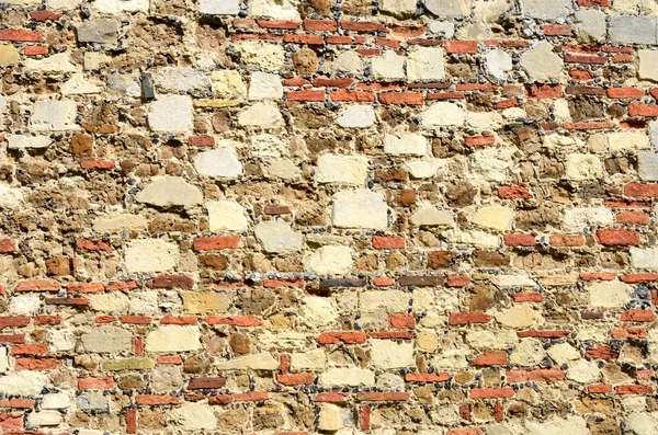 Parede de tijolo vintage em pedra vermelha — Fotografia de Stock