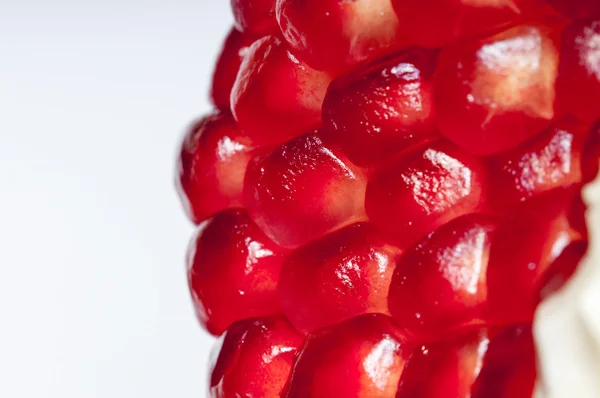Red, ripe  seeds of the garnet. — Stock Photo, Image