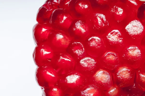 Garnet seeds on the white background. — Stock Photo, Image