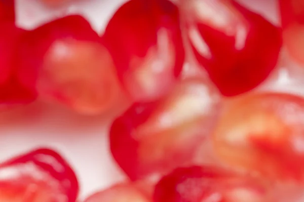 Garnet seeds. Blured background. — Stock Photo, Image