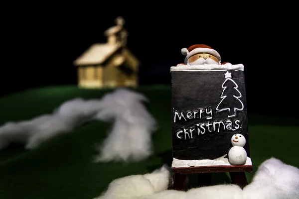 Placa de Natal na neve com Papai Noel — Fotografia de Stock