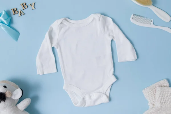 Top View Baby Clothes White Baby Bodysuit Mockup Blue Background — Stock Photo, Image