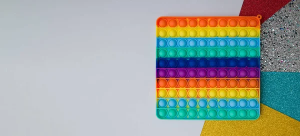 Bovenaanzicht Regenboog Siliconen Speelgoed Antistress Pop Het Kleurrijke Achtergrond Populaire — Stockfoto