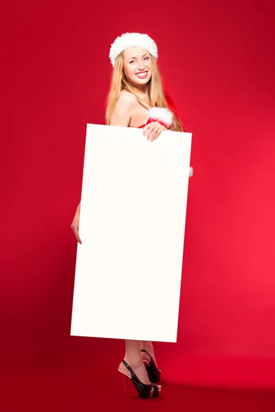 Santa woman pointing at blank whiteboard — Stock Photo, Image