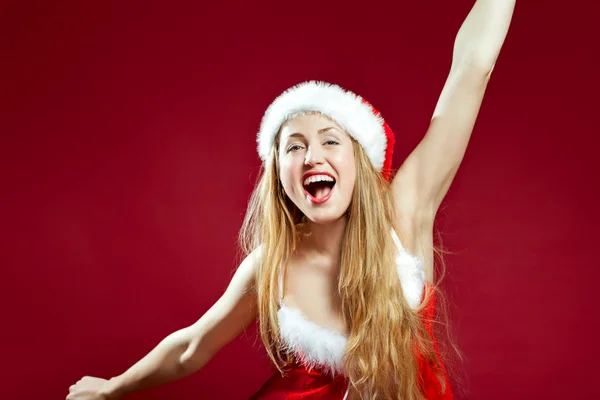 Sexy santa helper on red background — Stock Photo, Image