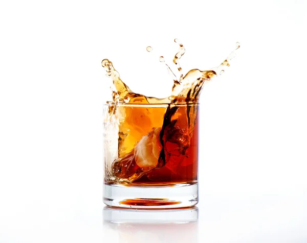 Splash of cola in glass isolated on white — Stock Photo, Image