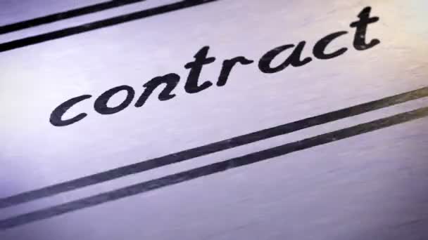 "contract" on a paper. Looping. — Stock Video