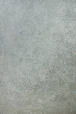 yüzey üzerinde soyut desenleri olan düz renkli çimento dokusu