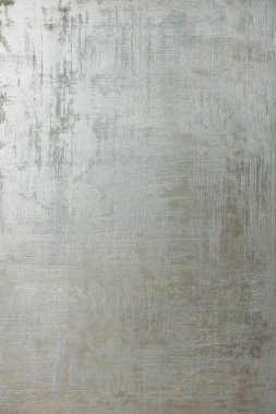 yüzey üzerinde soyut desenleri olan düz renkli çimento dokusu