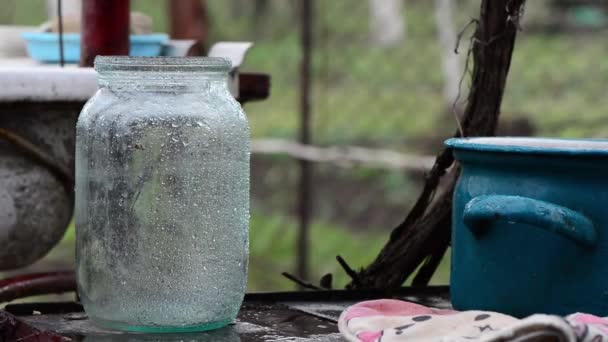 Empty Wet Glass Jar Rainy Weather Outdoor — Stock Video