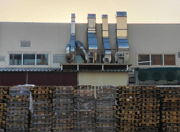 factory backyard exterior with wooden pallets row