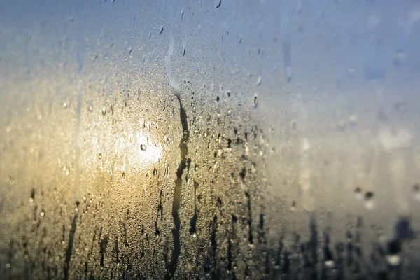 Raindrops on Glass Pane