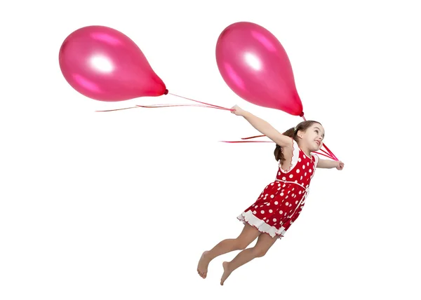 Menina voando em balões — Fotografia de Stock