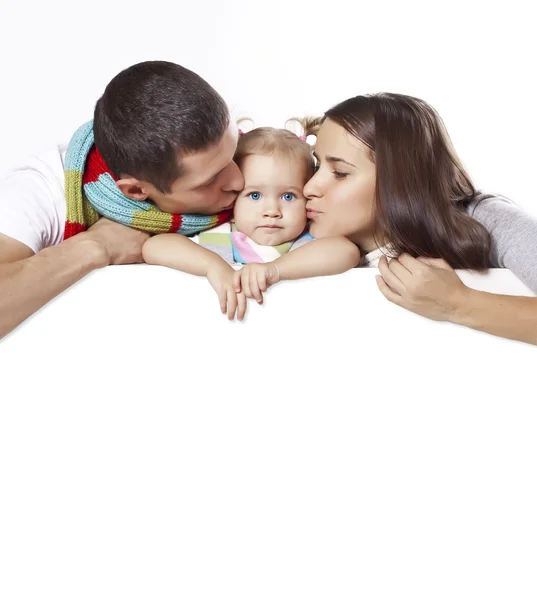 Familia joven con pancarta — Foto de Stock