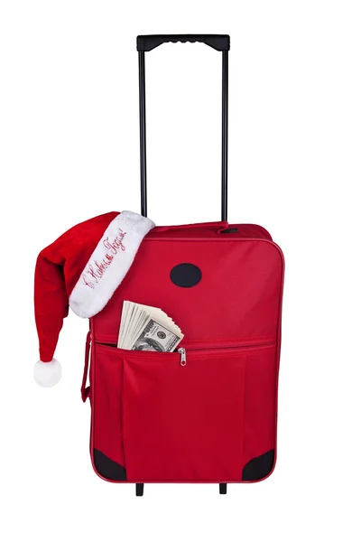Туристический чемодан с долларами и кепкой Санта-Клауса — стоковое фото
