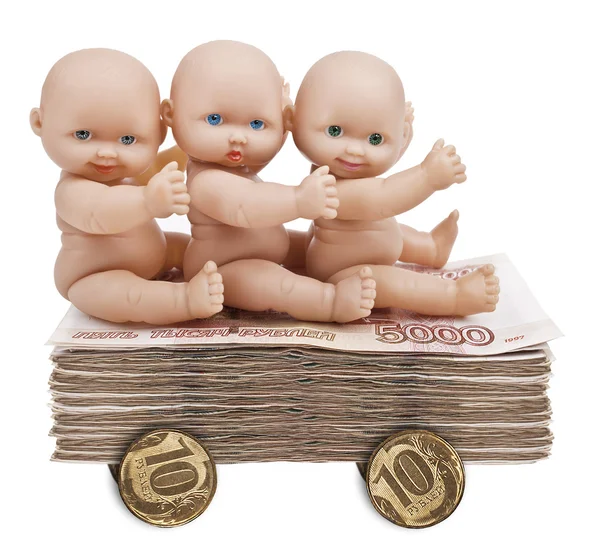 Three Pups are sitting on a trolley from a stack of money. — Stock Photo, Image