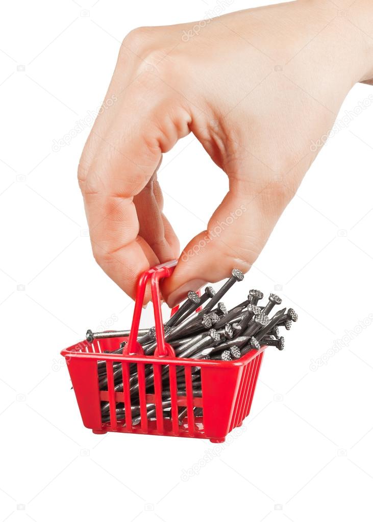 Shopping cart with nails in his hand on a white background