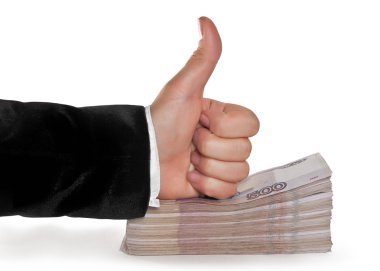 Hand on a stack of money with a raised thumb clipart
