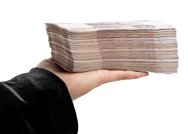 Una pila di soldi di carta sulla mano delle donne — Foto Stock