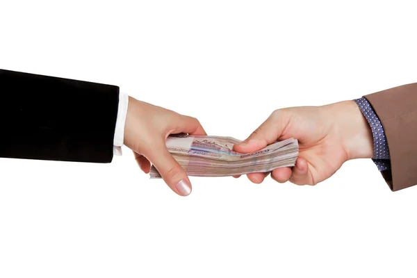 Mannelijke en vrouwelijke hand met een pack van Russische geld — Stockfoto