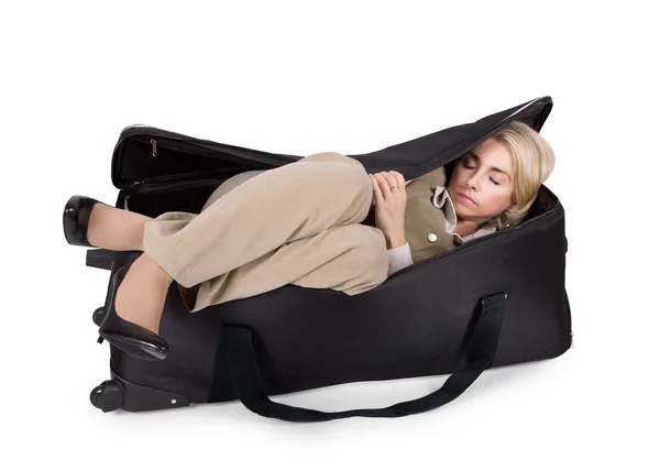 Деловая девушка спит в большой сумке — стоковое фото