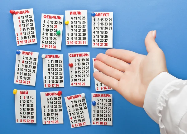 Mão apontando para o calendário para 2016 — Fotografia de Stock