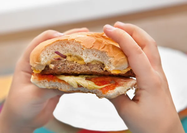 Burger in hands — Stock Photo, Image