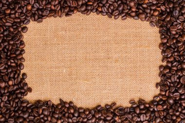 Tuval ve kahve çekirdekleri fotoğraf arka plan. Kopya alanı