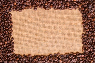 Tuval ve kahve çekirdekleri fotoğraf arka plan. Kopya alanı