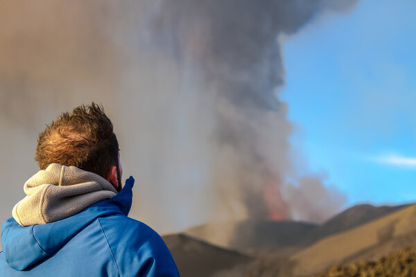 Volcano eruption. Mount Etna erupting from the crater Voragine