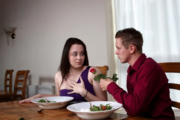 A young couple having a romantic meal