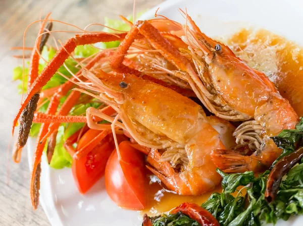 Jantar de lagosta frita com molho no prato Fotos De Bancos De Imagens Sem Royalties