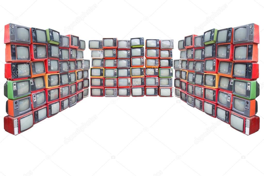 Many old vintage televisions pile up isolated on white backgroun
