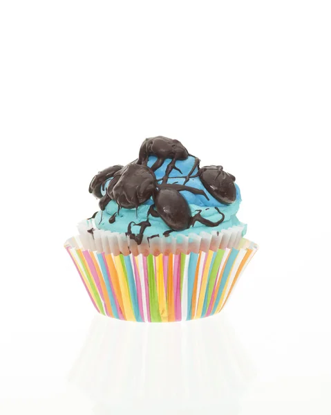Blue Frosted vanilla Cupake with chocolate topping, isolated — Stock Photo, Image