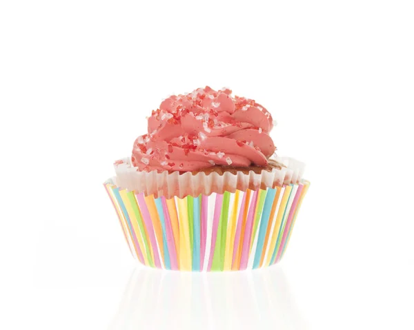 Orange fosted cupcake med randigt papper liner Stockfoto