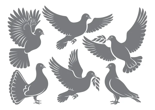 Palomas voladoras siluetas — Vector de stock