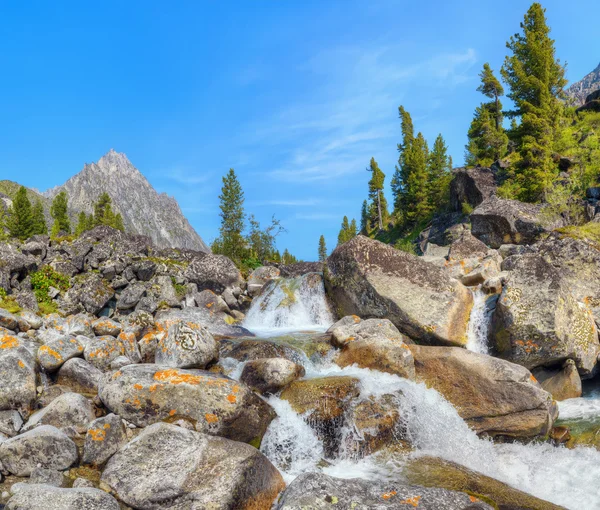 Small cascade of waterfalls on a mountain creek — Stock Photo, Image