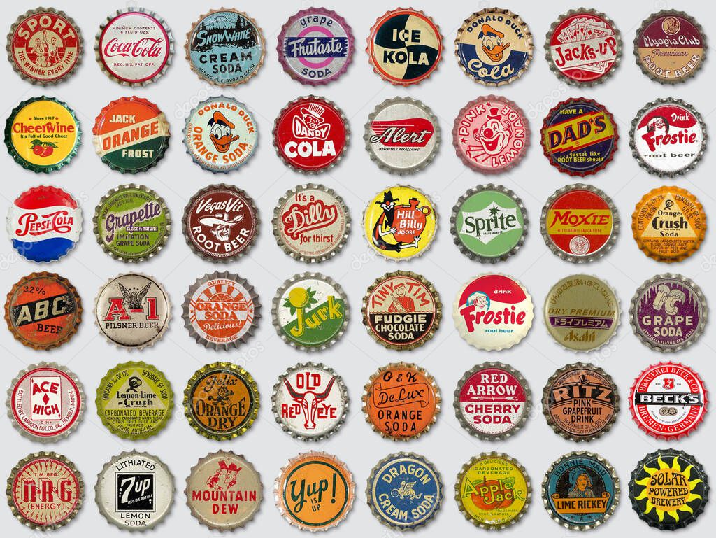 Vilnius, Lithuania - October 18, 2020: Collection of old used vintage soda and beer bottle caps on gray background