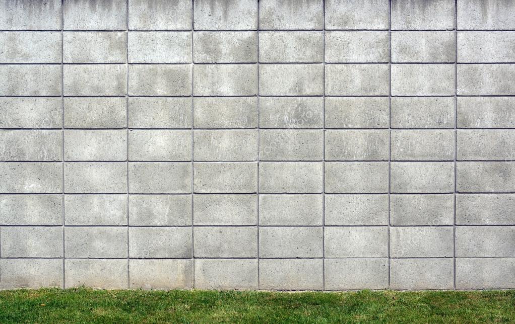 Concrete Block Wall Background with Grass — Stock Photo © NigelSpiers