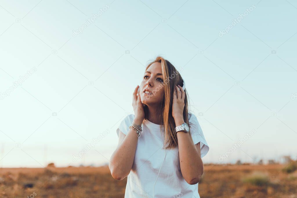 Young woman with her laptop listened external communications