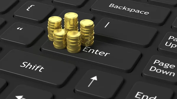 Stapels van gouden munten op zwarte laptop toetsenbord — Stockfoto