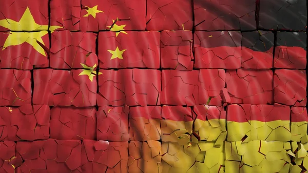 China and Germany flags, with brick wall texture and and cracks — Stock fotografie