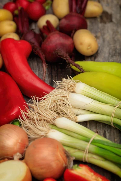 Various fresh raw vegetables on wooden surface — Stock Photo, Image