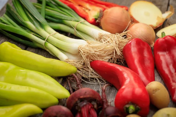 Various fresh raw vegetables on wooden surface — Stock Photo, Image