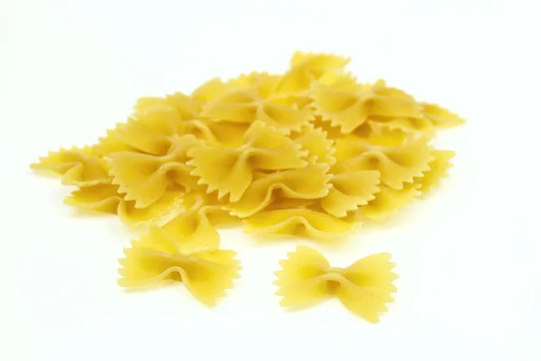 Heap of farfalle pasta, on white background. — Stock Photo, Image